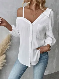Detailed view of a white textured off-the-shoulder button-down shirt with a lapel collar