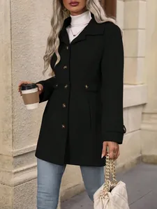 Detailed view of women's slim fit black wool coat with gold button accents