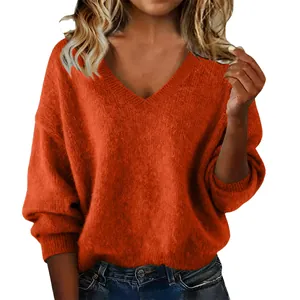 Close-up of stylish burnt orange V-neck knitted sweater with soft fuzzy texture