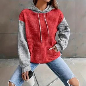 Women's red and grey color-block waffle knit hoodie featuring a casual urban street style