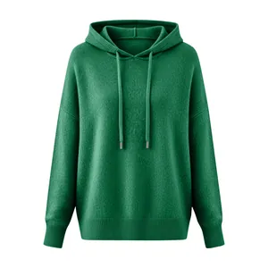 Detailed macro view of soft green knitted hooded sweater with drawstring accents