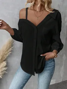 Detailed view of black textured cold shoulder shirt with elegant lapel and buttons