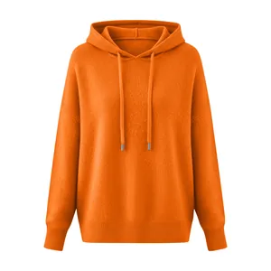 Full front view of bright orange hooded drawstring sweater with soft knitted texture