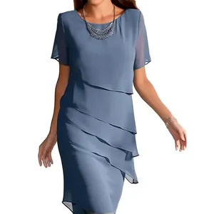 Close-up of elegant dusty blue layered chiffon dress showing the pleated tiered design