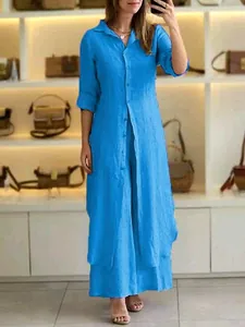Elegant blue cotton linen two-piece set with a long-sleeved shirt and matching wide-leg pants