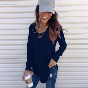 Close-up of a stylish navy blue long-sleeve T-shirt featuring a lace-up V-neck design