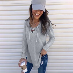 Detailed close-up of grey long sleeve V-neck lace-up loose fit casual top for women
