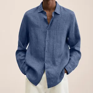 Detail view of blue long-sleeved linen shirt for men with button-down closure.
