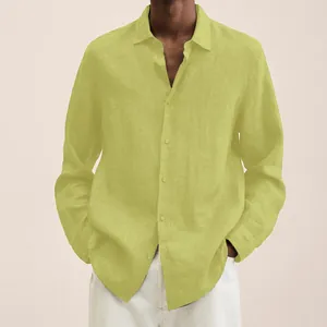 Close-up of men's loose linen shirt featuring button-down design and breathable fabric.
