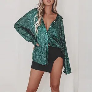 Close-up of a green sequined long-sleeve shirt with sparkling texture and lapel design.