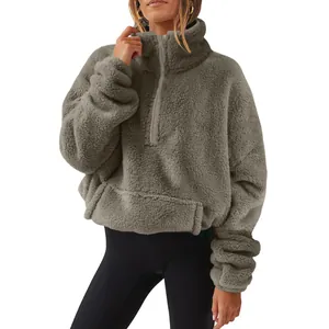 Detail view of women's half-zip stand-up collar fuzzy fleece sweatshirt in grey