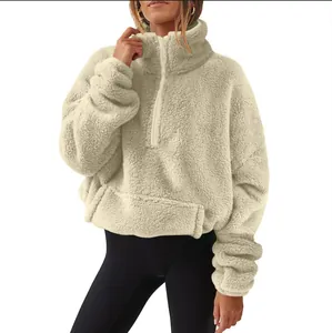 Warm beige half-zip fleece sweatshirt with a cozy high collar and soft plush texture