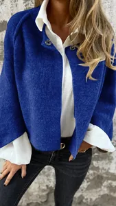 Detail view of the soft wool-like texture on this vibrant blue short jacket for women.