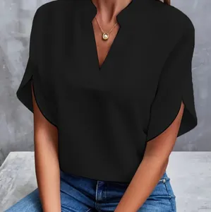 Detail view of a woman wearing a black V-neck casual short sleeve blouse