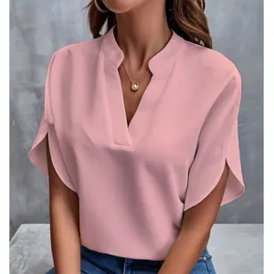Detailed view of women's pink V-neck short-sleeved blouse with elegant split cuffs