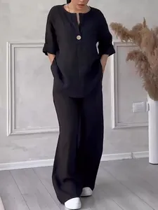 Front view of black loose-fitting cotton linen two-piece set with wide-leg pants
