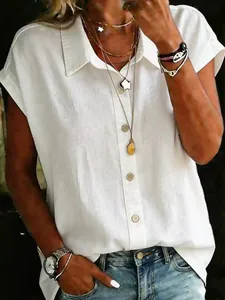 Detail view of a white casual loose short-sleeve button-down shirt with collar