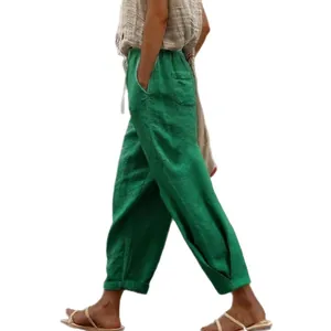 Stylish women's casual green cotton linen pants featuring side pockets and elastic waist