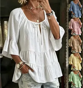 Detailed view of women's tiered bell sleeve blouse showing multiple color options