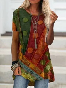 Detail of women's loose short sleeve T-shirt with vibrant digital geometric print