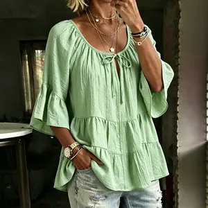 Casual loose light green blouse with 3/4 bell sleeves and tiered pleated tie-neck design
