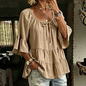 Women's casual beige tiered shirt with ruffled 3/4 sleeves and bohemian tie neck detail