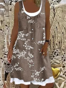 Vestido midi informal sin mangas marrón con estampado floral, botones y dobladillo blanco