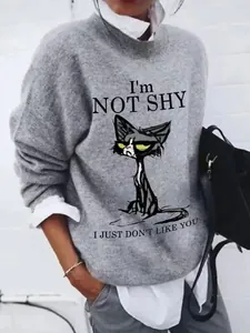 Detail of grey cat print sweatshirt with I'm Not Shy slogan text in a casual lifestyle style