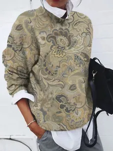 Close-up of vintage paisley print women's loose long sleeve top with layered collar