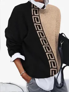 Detailed view of two-tone long-sleeve top with vintage Greek key geometric print