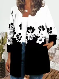 Close-up of the black and white floral print detail on a women's long sleeve jacket.