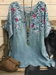 Detailed view of women's casual round neck floral print top with cascading leaf design