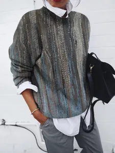 Detailed view of a women's vintage abstract floral print loose long-sleeved casual top.