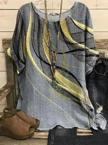 Detail of a casual women's loose grey top with yellow abstract wavy line prints