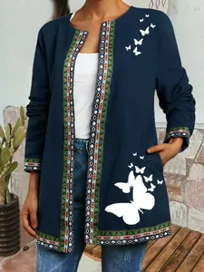 Close-up of ethnic style open cardigan with white butterfly prints and patterned trim