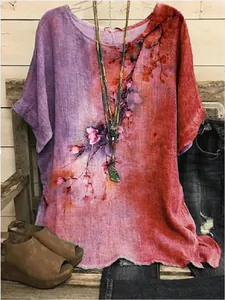 Detailed view of women's loose floral print tunic top with rustic styling and accessories