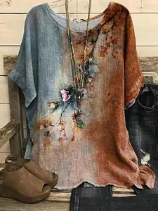 Detail view of the artistic floral print on this split-color loose round neck linen top.