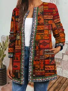 Close-up of vintage ethnic patchwork print open front cardigan jacket