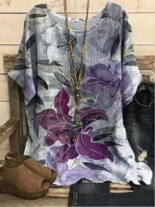 Bohemian style women's loose short sleeve top featuring artistic purple floral print