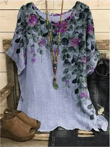 Detailed view of elegant purple floral print on loose round neck lavender tunic top for women