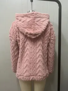 Back view of pink plush hooded sweatshirt featuring intricate jacquard cable pattern