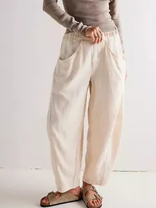 Minimalist casual loose cotton linen carrot pants in beige with elastic waist and pockets