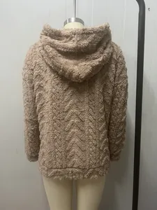 Back view of a khaki women's oversized fleece hoodie with chevron jacquard pattern