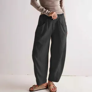 Casual women's black cotton linen loose-fit carrot pants with elastic waist and pockets