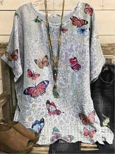 Boho style women's loose round neck top with vibrant butterfly prints and mosaic pattern