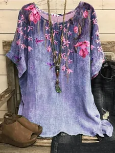 Detail of casual loose round neck top with elegant purple floral and hummingbird prints