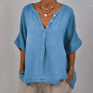 Loose fit light blue linen cotton blouse for women featuring V-neck and button details