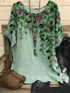Detailed view of women's casual floral print top with bohemian styling and accessories