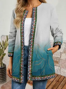 Detail view of retro ethnic print cardigan with gradient teal and white colors.
