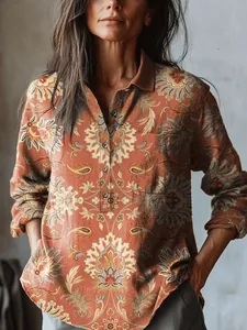 Detailed view of women's long-sleeve shirt with vintage floral and paisley print